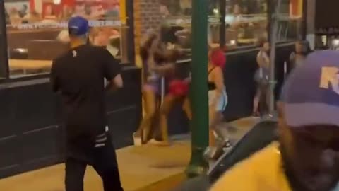 The moment a policeman separated a fight