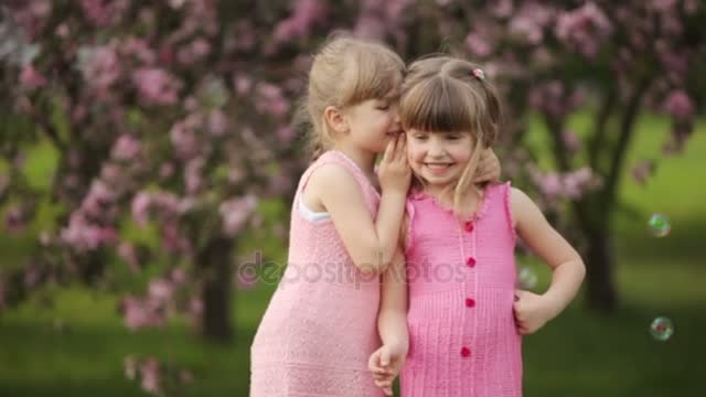 firls whispering and smile