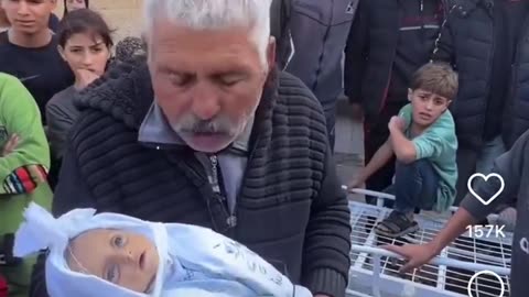 Palestinian Pretending Doll Is His Dead Grand Daughter