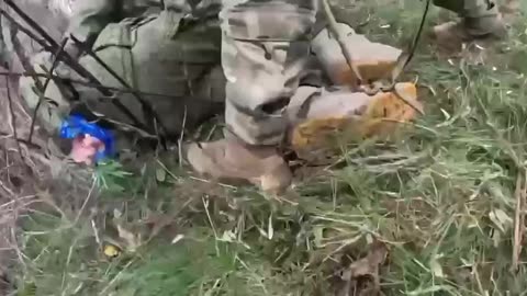 Ukrainians Physically Carry an Enemy Soldier Off of the Battlefield