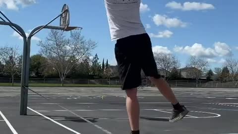 Guy makes Basketball Shot and Throws Rugby Ball To His Friend While Balancing on Slackline