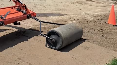 Kubota L2501 using sod roller