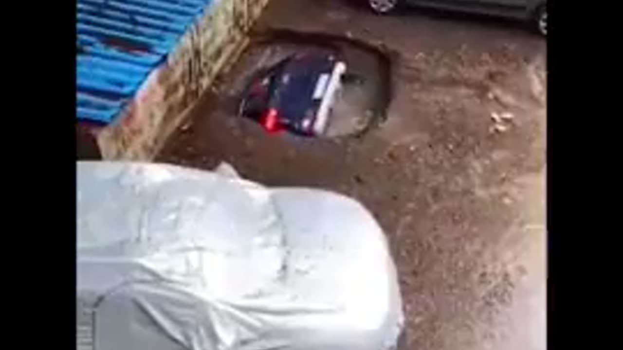 Car Consumed By Sink Hole