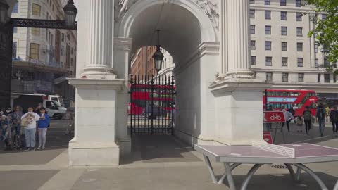 Tracking Shot of Traffic Through the Marble Arch