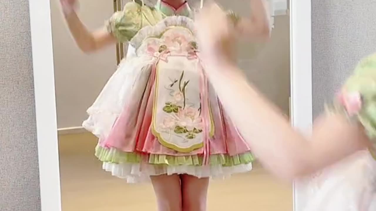 Girl dancing in front of a mirror in vintage clothes