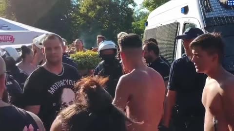 Better angle shows Polish men trying to get the 4 migrants accused of molesting children at a pool..