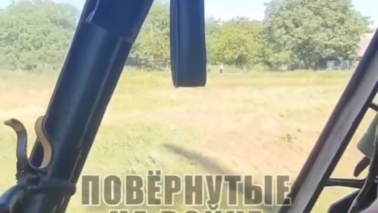 A Russian military helicopter pilot hands sweets (candies) to Donbassian children