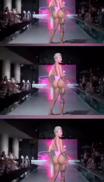 A "women’s" swimsuit model walks the runway at Miami Swim Week.