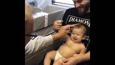 Doctor distracts baby from her shots with goofy tune