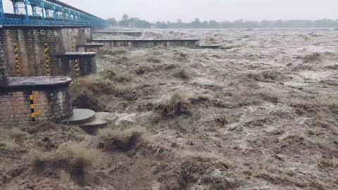 Flood scene in india at the dam on the river