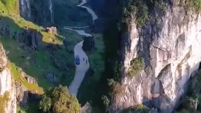 The mountain and the river are joined together.