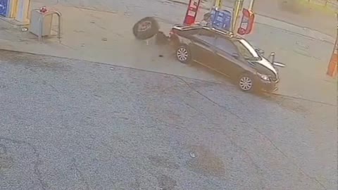 The car parked outside the gas station was met by unexpected trouble.