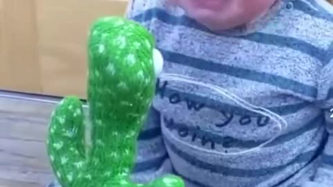 #Cute babies 👼 plying with# Dancing cactus #🌵