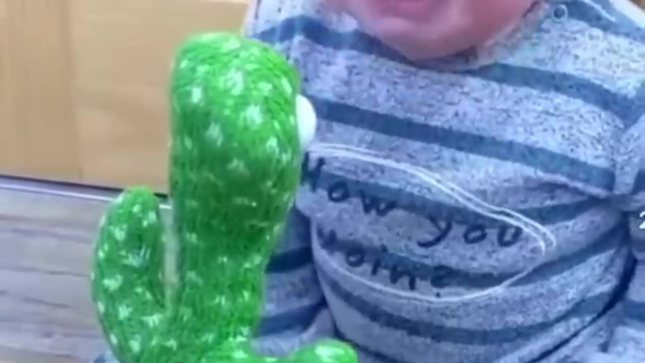 #Cute babies 👼 plying with# Dancing cactus #🌵