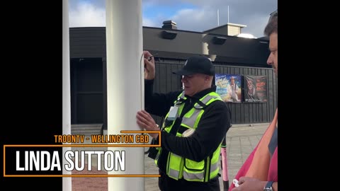 Te Papa workers raising the rainbow flag outside the UNSILENCED venue