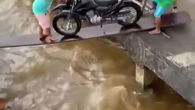 Funny pushing a motorcycle in to a boat gone wrong. (Cute Video)