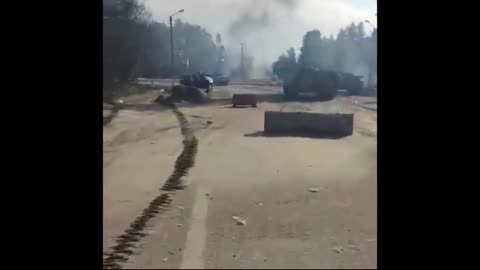 Ukrainian warrior with NLAW confidently walks across the battlefield