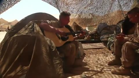 Marine plays guitar to keep home close