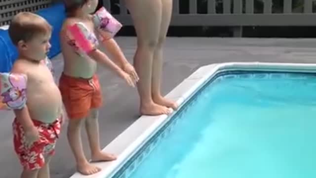 Child Does a Spectacular Belly-Flop into the Pool