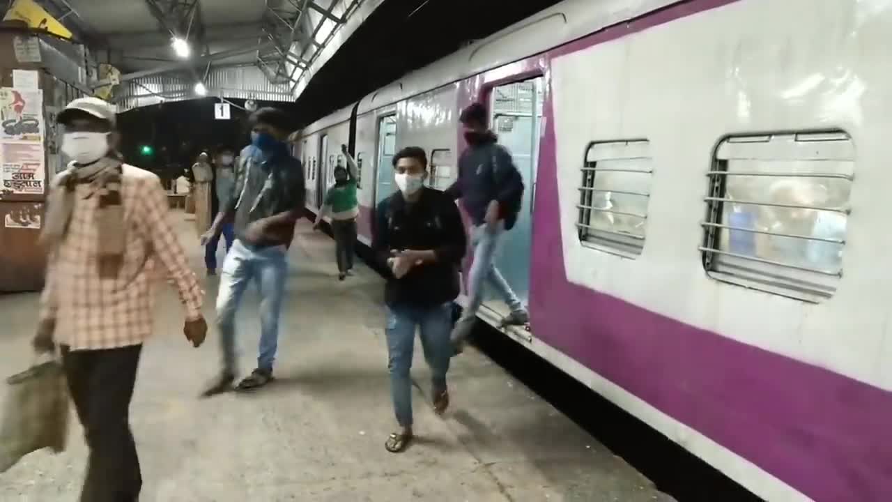 A Reckless Lady is Trying to Board a Running Train in a Very Risky way.