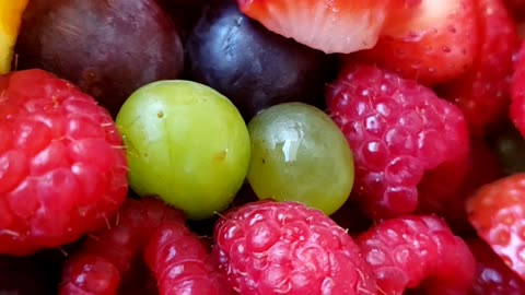 Chopped fruits on a plate. Beauty of cut fruits