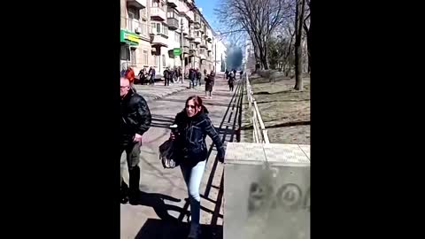 People run from tear gas at Ukrainian protest