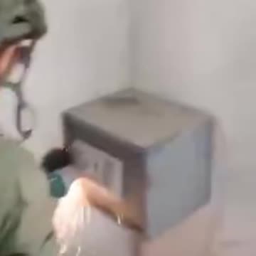 ISRAELI SOLDIERS FILM THEMSELVES AS THEY ARE BREAKING INTO A FAMILY'S SAFE IN GAZA (1)