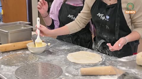 School students cooking food for poor