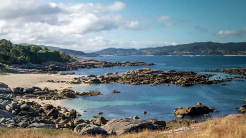 view of a beautiful beach full of rocks