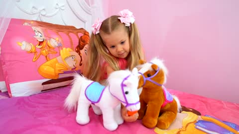 Diana and Roma Plays with toy horses