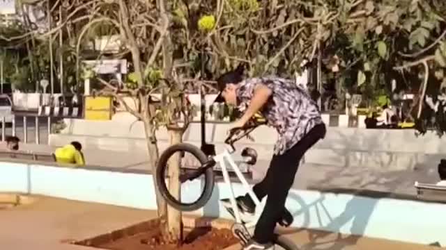 Guy Shows Tricks While Riding BMX Bike At Skatepark