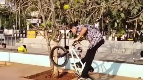 Guy Shows Tricks While Riding BMX Bike At Skatepark