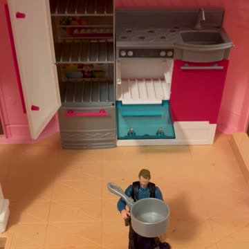 Clay checks out Barbie's giant cooking pot