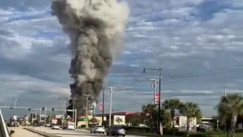 Fireworks Whistale as Flames Engulf Store Following Car Crash