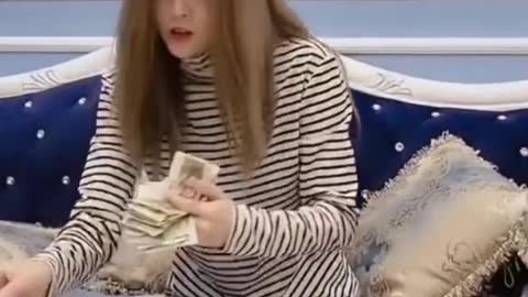 Stingy woman counting money