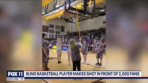 Blind basketball player makes shot in front of 2,500 fans