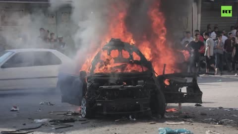 Palestinians burn seized Israeli cars, celebrate Hamas’ attack on the country