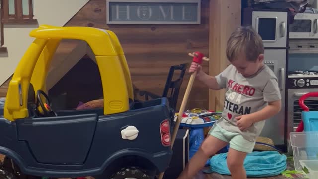 Kid Preps To Repair His Toy Car