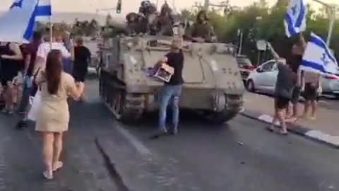 Israeli civilians saying goodbye to soldiers that will soon be sent into Gaza