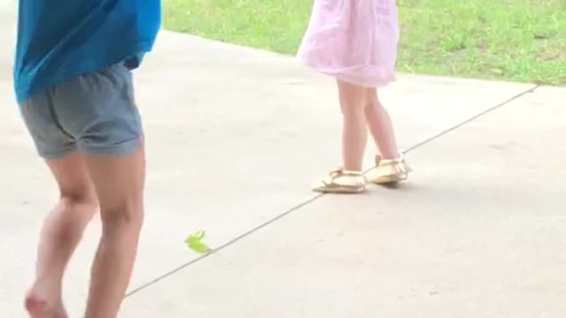 Playing in the rain with her girlfriends