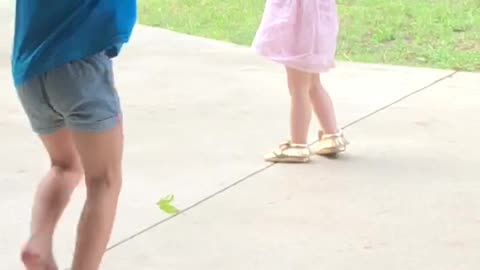 Playing in the rain with her girlfriends