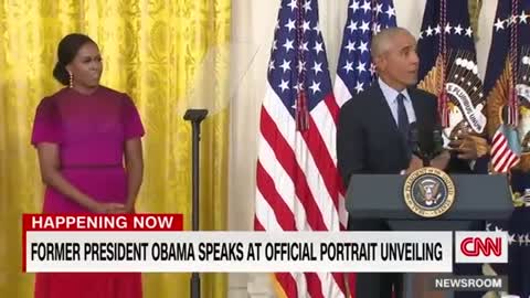 Barack Obama gives a speech after the unveiling of his White House portrait