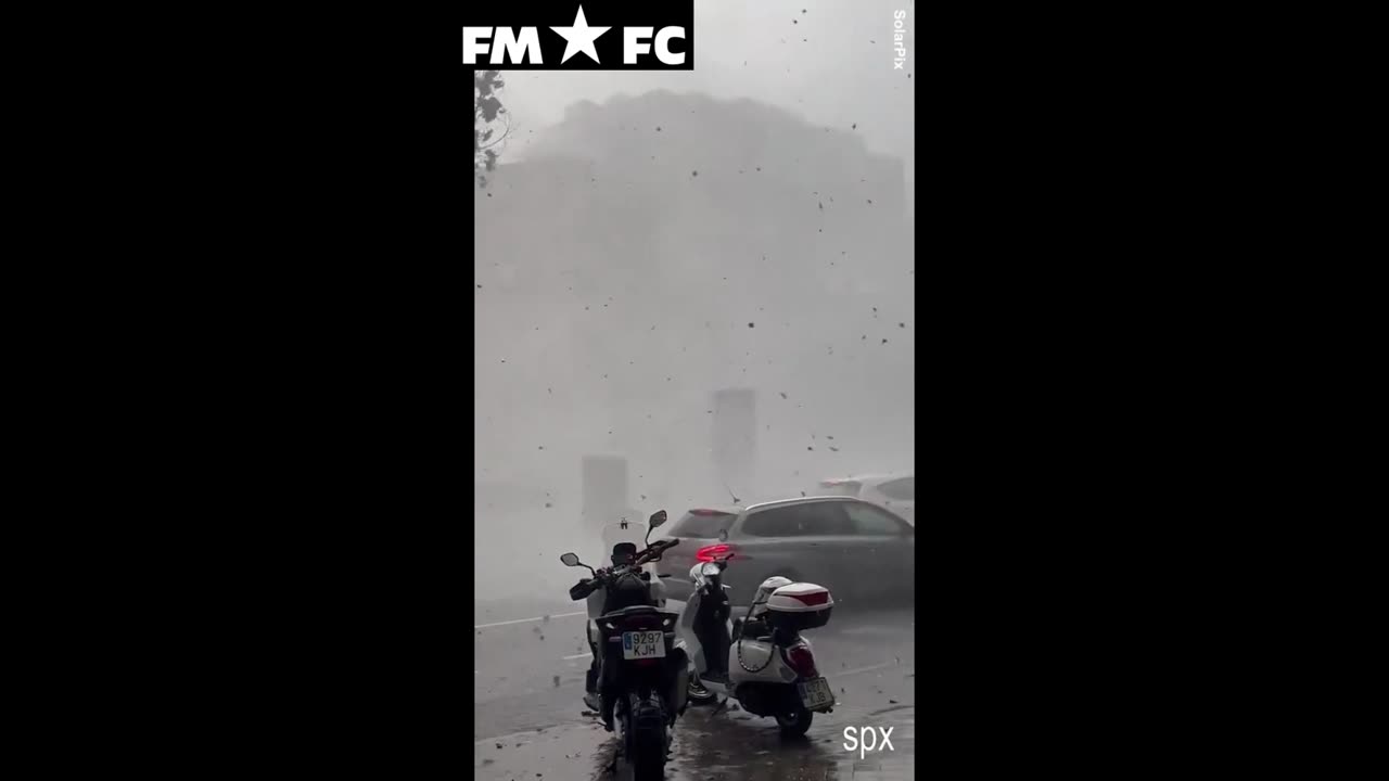 Summer storm rips through Madrid toppling trees and flooding streets