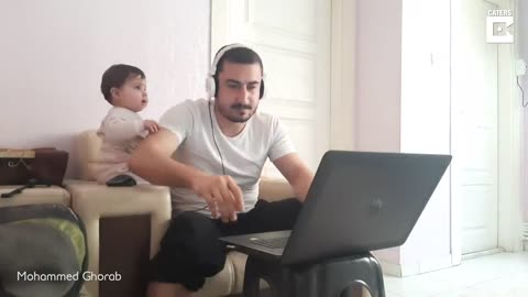 Baby Distracts Dad From Working From Home