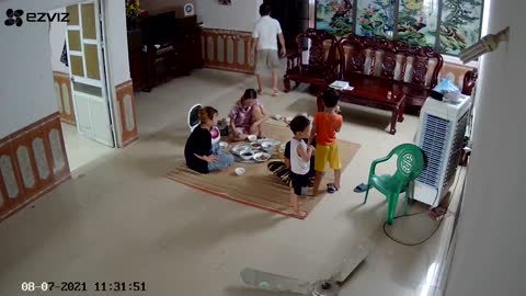 Family Dinner Interrupted by Falling Fan