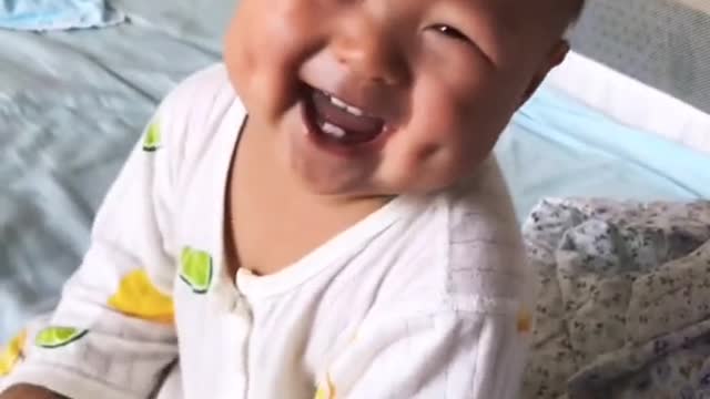 adorable baby having lots of laughs