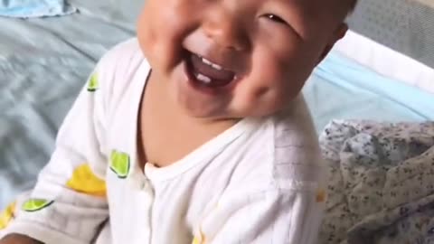 adorable baby having lots of laughs