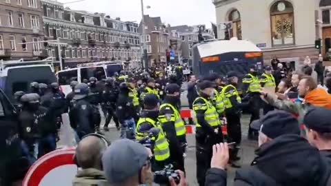 Dutch army veterans have stood as human shields between police and activists during the ongoing