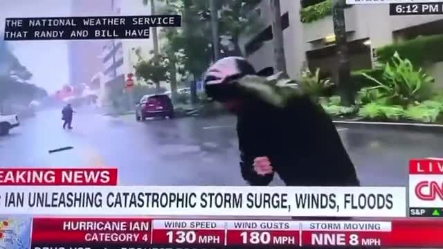 Extreme Weather Reporting While Driver Walks Calmly To His Car