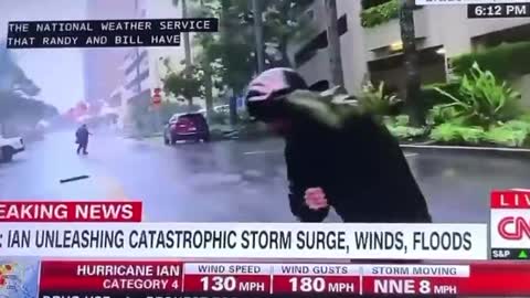Extreme Weather Reporting While Driver Walks Calmly To His Car